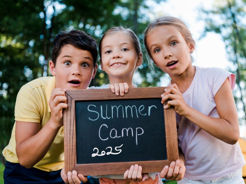 kids holding summer camp chalkboard sign canva