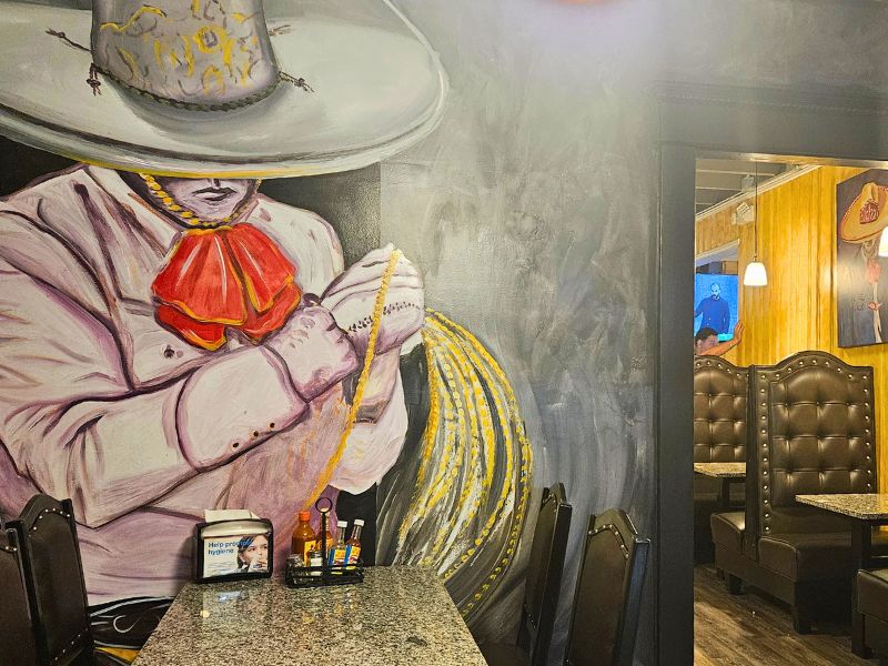 El Tapatio Mexican Restaurant with vibrant, hand-painted murals on the walls