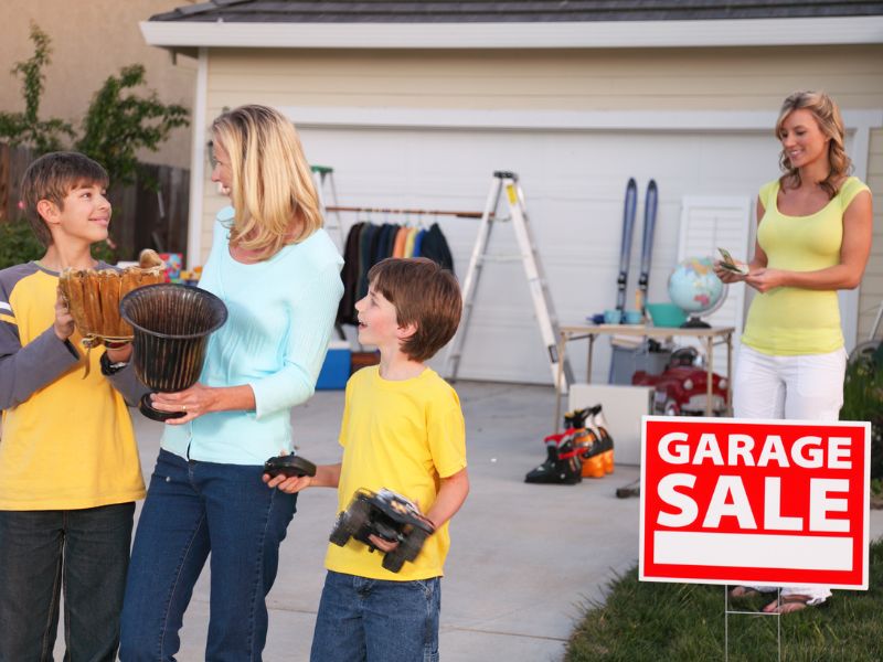garage-sale-family-making-purchase