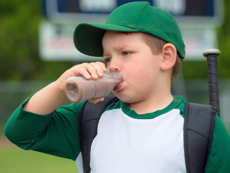 Baseball kid with milk