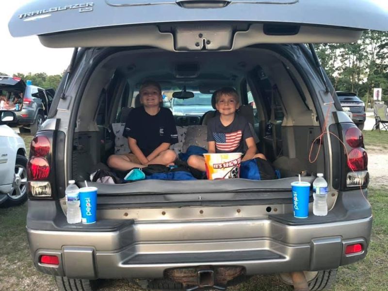 drive in movie theater boys sitting in back of car with snacks Koss