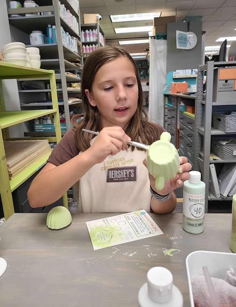 Things-to-do-with-teens-tweens-The-Mud-Room-girl-painting-pottery
