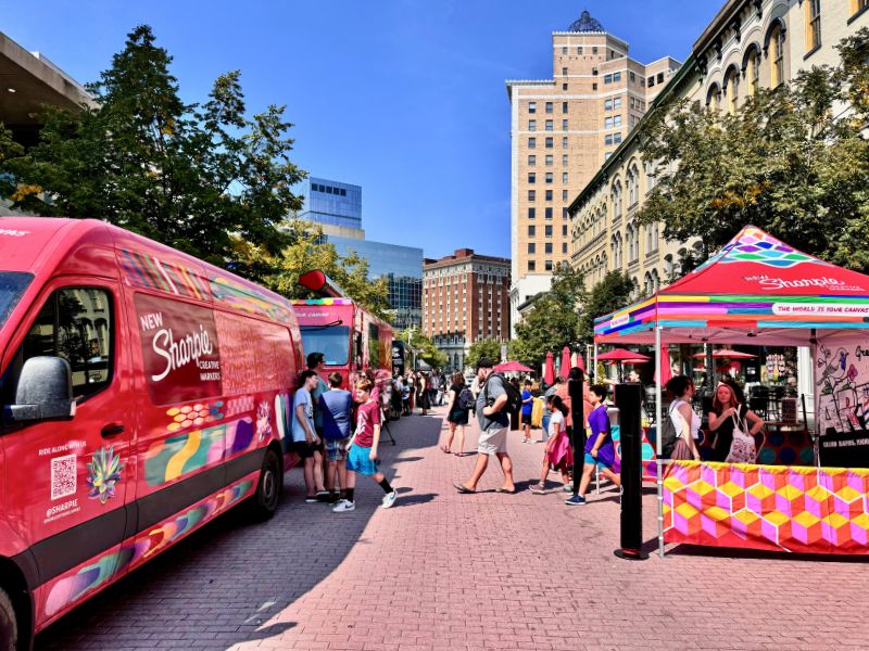 A view of a bustling street in Grand Rapids during ArtPrize 2024