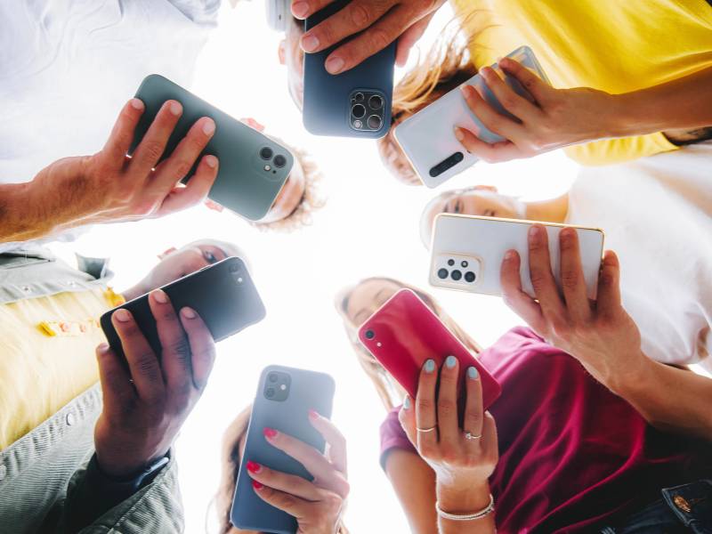 Teens in Circle with Phones