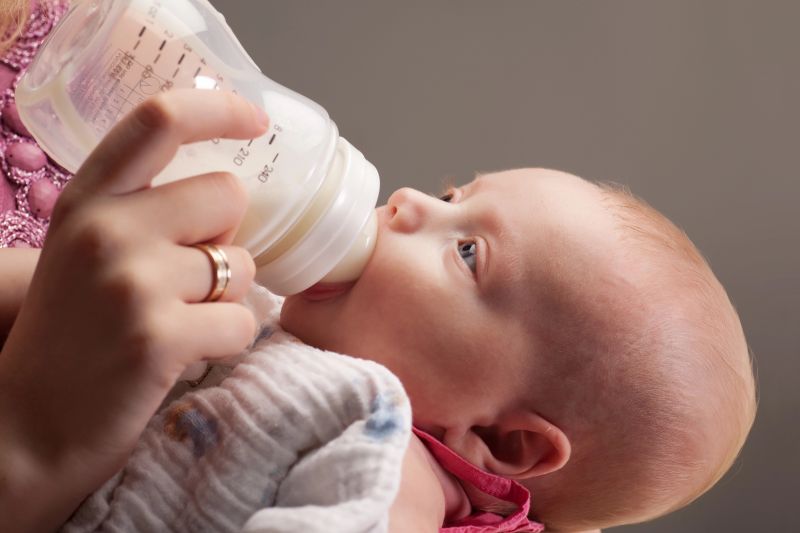 baby drinking bottle of milk