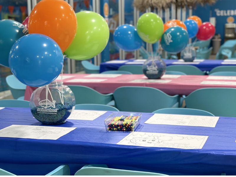 Goldfish swim school grandville birthday party tables set up close up look