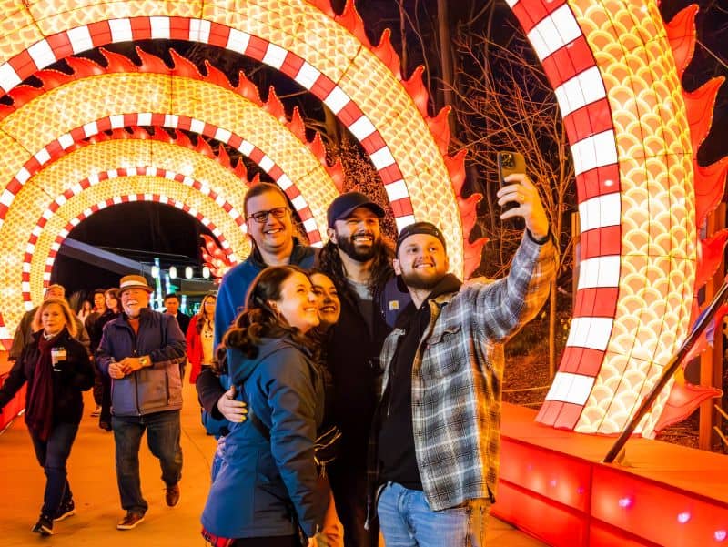 John ball zoo lantern festival poeple taking selfie in tunnel