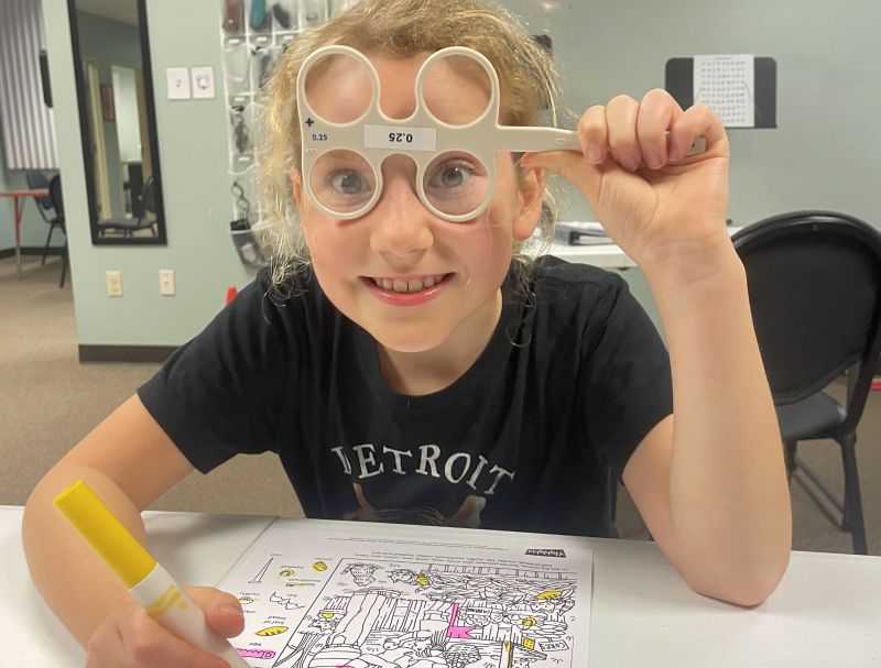 Wow Vision therapy girl looking through glasses at camera