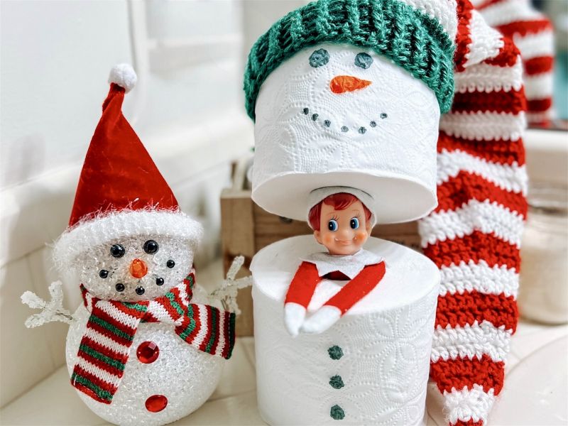 Elf on the shelf ideas elf in snowman toilet paper rolls