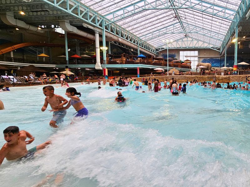 View of kids enjoying the huge wave pool at Kalahari waterpark Sandusky