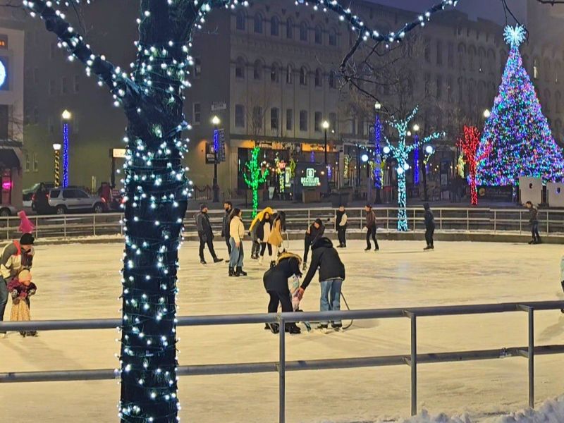 an evening ice skating around the rink at rosa parks circle in grand rapids michigan