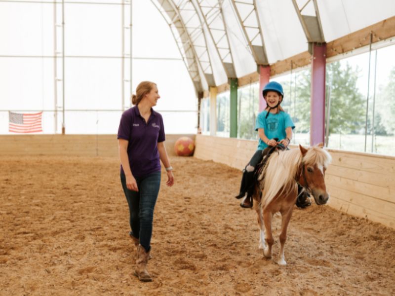 Legacy Stables and Karin's Horses - 2025 GR Summer Camp - Camper Riding Horse in Arena