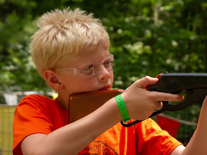 Pine Ridge Bible Camp - 2025 GR Summer Camp - Kid at shooting range