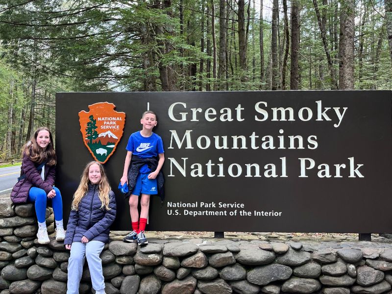 Things to do in the smoky mountains: pose by the entrance sign to Great Smoky Mountains National Park