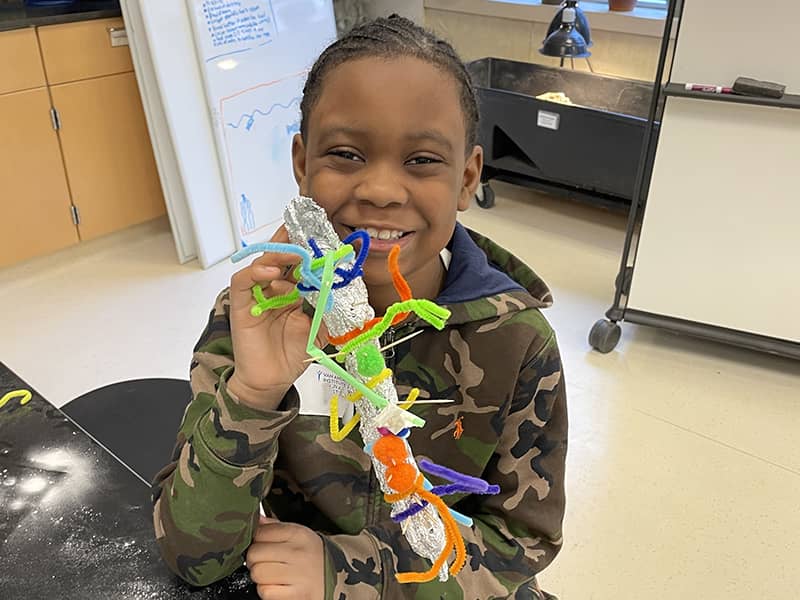 Van Andel Institute for Education - 2025 Summer Camp - Boy Engineering a Salamander (1)