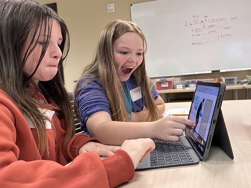 Van Andel Institute for Education - 2025 Summer Camps - Girls Discovering on Computer (1)