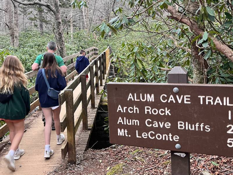 Smoky Mountains Things to do, Family corsses log bridge at the start of the Alum Cave trail