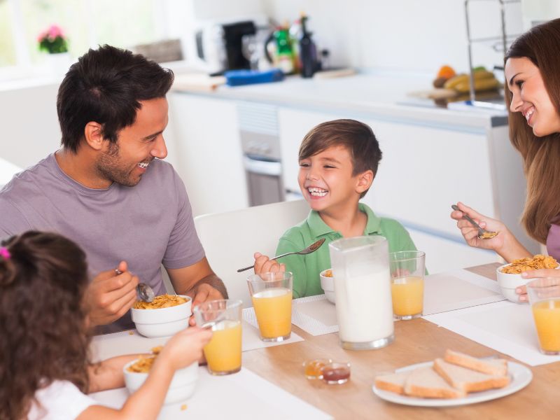 family around the table eating breakfast