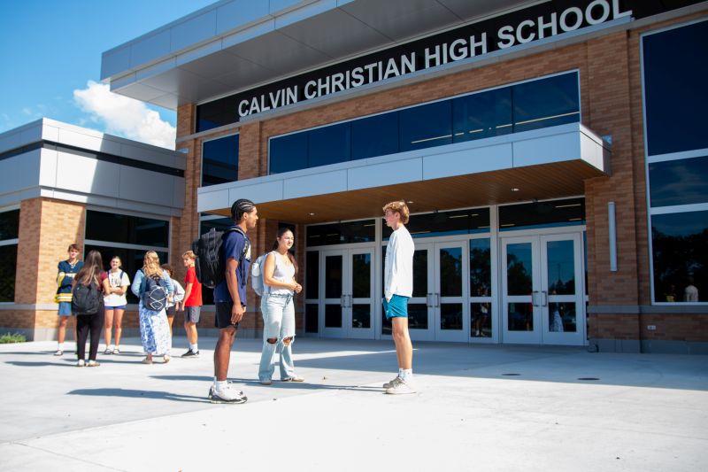 Grandville Calvin Christian High school exterior kids in front
