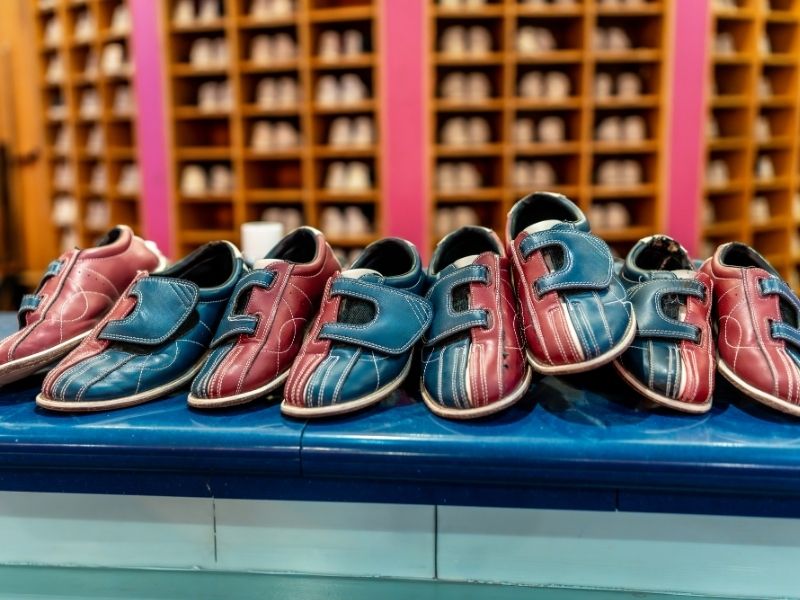 kids bowl free bowling shoes lined up on counter 