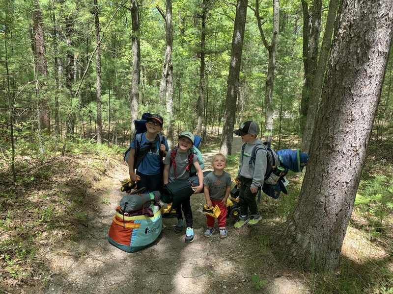 kids hiking camping, tents on backs