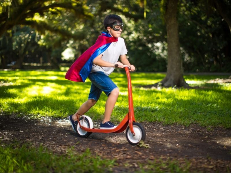 Superhero Kid On Scooter Canva