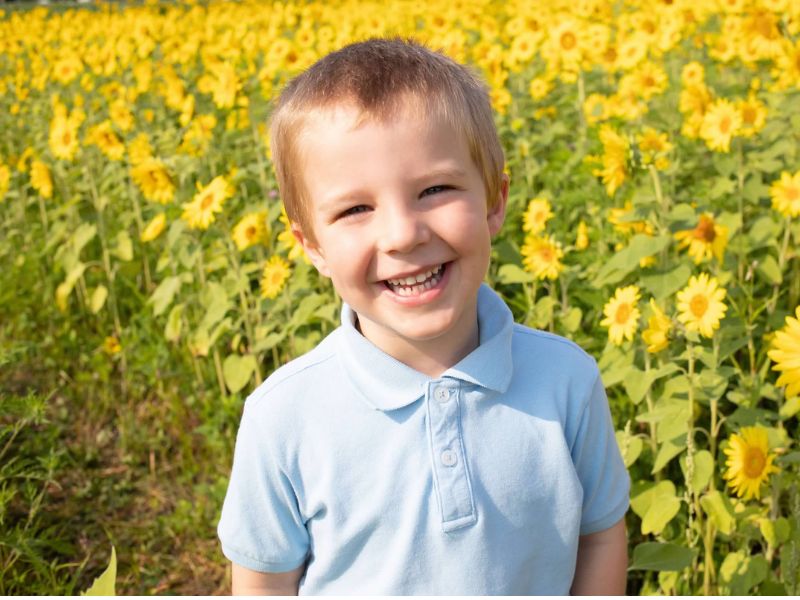 young boy in sunflower field Rudd