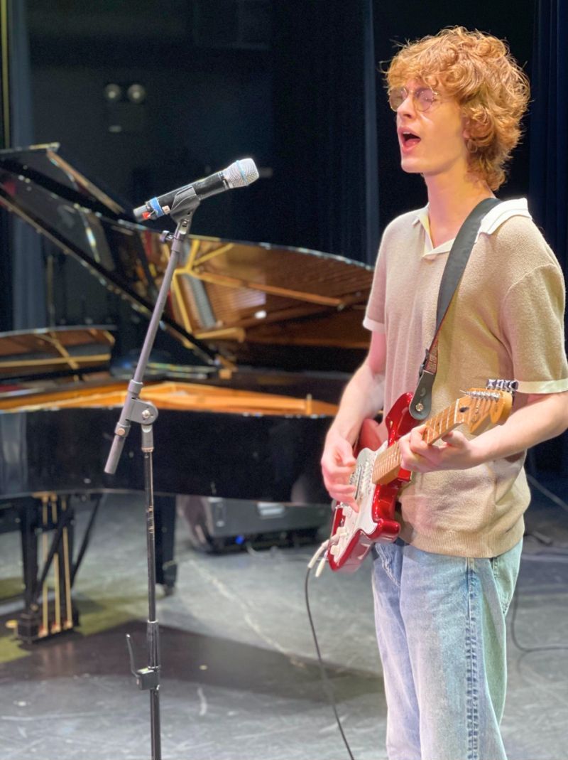 Academy of Music boy playing guiter and singing at graceland