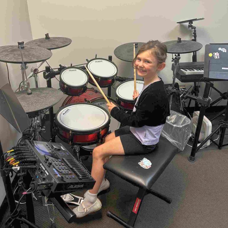 Academy of Music girl during drums class
