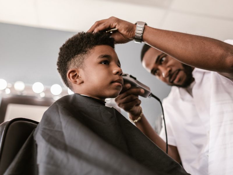 Kids Haircut Man Using Shaver On Boy