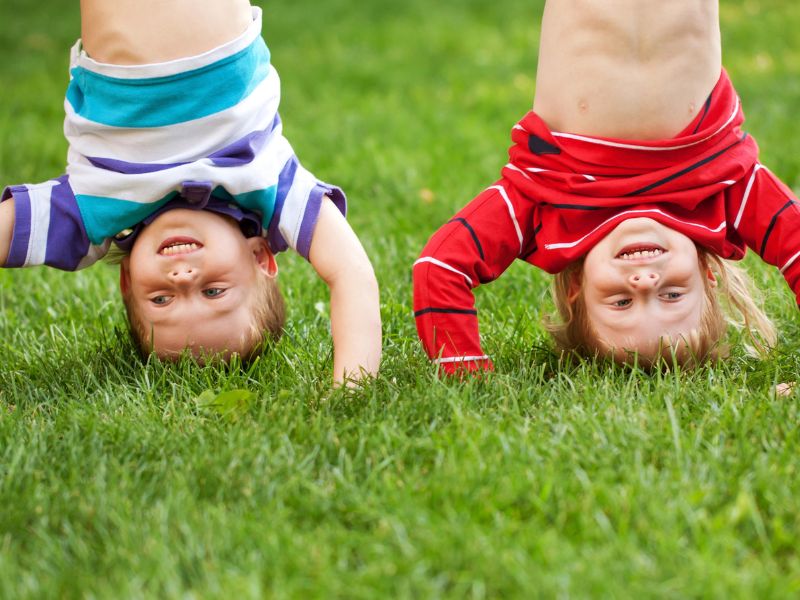 Kids outside upside down