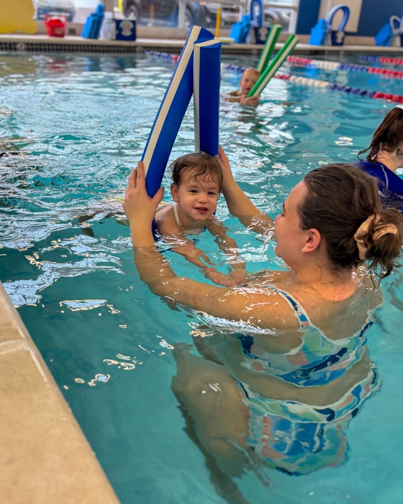 Aqua-Tots kid with pool noodle