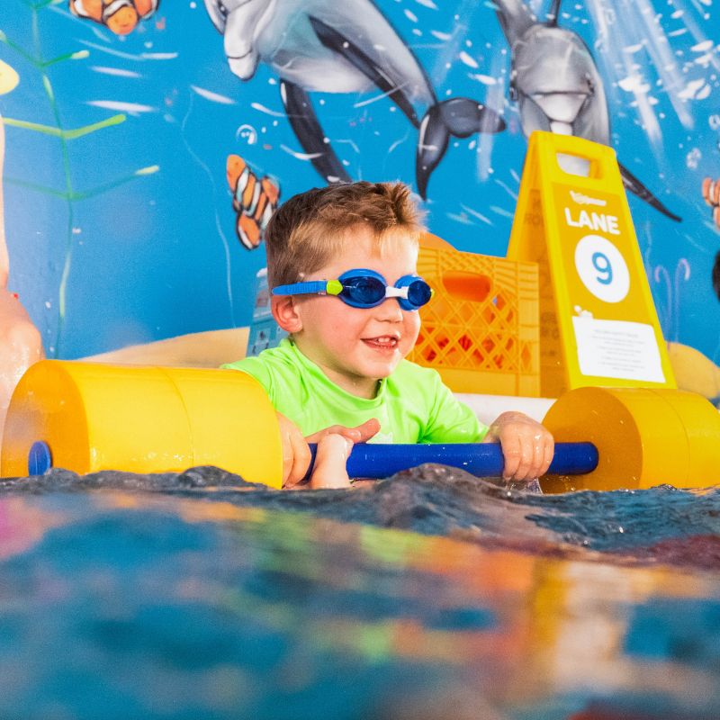 Goldfish Swim School Boy With Pool Floatation Device