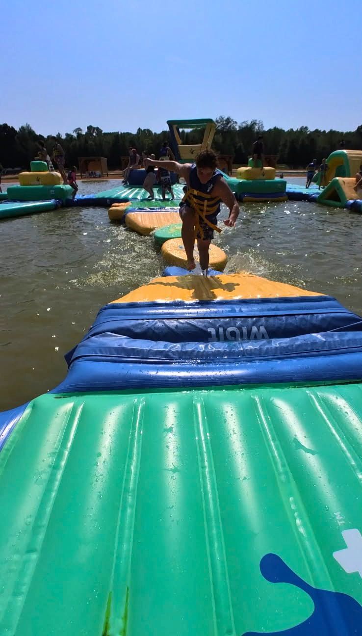 Lake Arvesta Farms Kid Running On Inflatable Course Ver